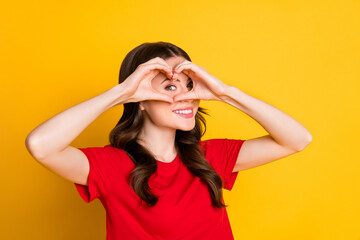 Poster - Photo of positive girl make fingers heart face look in camera love symbol isolated over bright shine color background