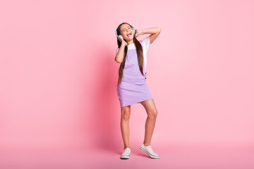 Sticker - Full size photo of crazy little kid listen wireless headset music sing wear violet overall isolated on pastel color background