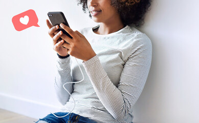 Wall Mural - Black woman using her smartphone