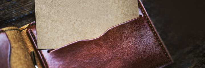 Wall Mural - name card mockup in a leather wallet website banner template