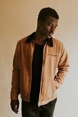 Wall Mural - Brown short jacket mockup on African Amercan male model in studio