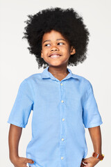 Canvas Print - Black boy wearing blue shirt in studio