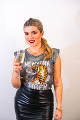 Poster - Vertical shot of an attractive stylish  woman with a glass of champagne