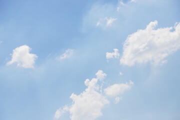 Wall Mural - Light blue sky with natural white fluffy clouds