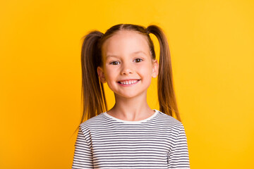 photo of happy cute sweet little girl happy beaming smile isolated on bright shine yellow color back