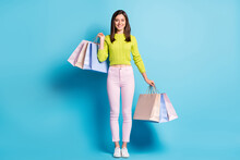 Photo Portrait Full Body View Of Smiling Woman Holding Shopping Bags Isolated On Pastel Blue Colored Background