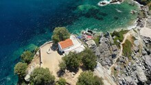 Aerial Drone Video Of Picturesque Chapel Of Saint John Built In Famous Cliff Where Mamma Mia Movie Was Filmed, Skopelos Island, Sporades, Greece