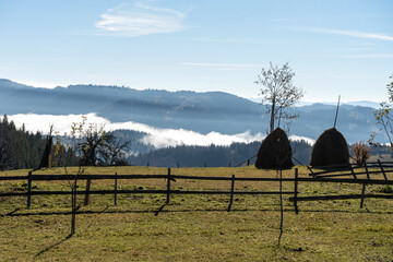 Wall Mural - sunrise view from the mountains of Romania autumn with fog