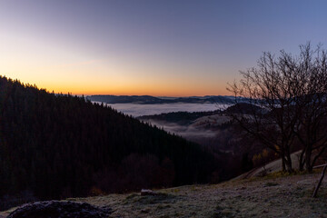 Wall Mural - sunrise view from the mountains of Romania autumn with fog