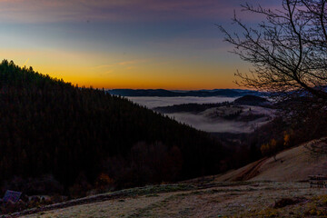 Wall Mural - sunrise view from the mountains of Romania autumn with fog