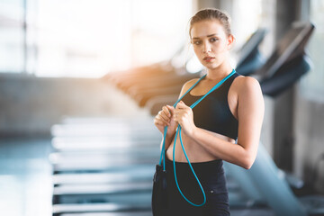 Poster - young slim sexy sporty woman model exercise with black sportswear working out in fitness gym