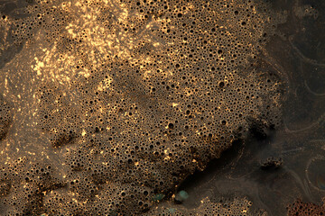 Macro black and gold Abstract bubble drop texture background. Acrylic color in water and oil.