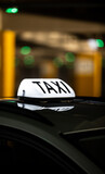 Fototapeta  - Taxi sign at the city during the night