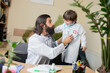 © master1305 - Paediatrician doctor examining a child in comfortabe medical office. Healthcare, childhood, medicine, protection and prevention concept. Little boy trust to doctor. Having fun while listening to lungs