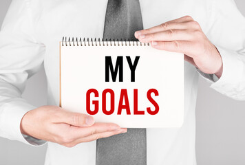 Poster - businessman with notebook with text my goals