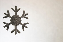 Silhouette Of Black Snowflake On Background Like A Snow. Copy Space.
