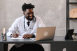 © kalinichenkod - telehealth with virtual doctor appointment and online therapy session. Black doctor online conference