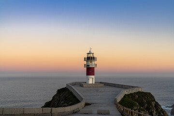 Poster - Cabo Ortegal lighthouse on the coast of Galicia at sunrise