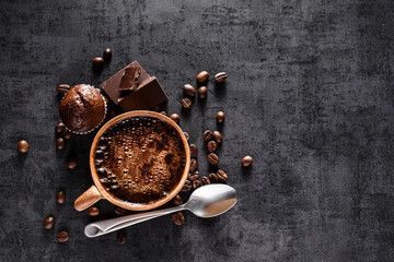 Wall Mural - Freshly brewed espresso on a black stone table cup. Roasted arabica and robusta coffee beans.Coffee beans wallpaper.Top view, flat lay with copy space for your text.