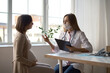 © natapetrovich - Happy pregnant woman visit gynecologist doctor at hospital or medical clinic for pregnancy consultant. Doctor examine pregnant belly for baby and mother healthcare check up. Gynecology concept.