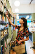 © BONNINSTUDIO/Westend61 - Customer looking for product at shelf in a store