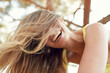 © philipp@nemenz.de/Westend61 - Portrait of laughing young woman with blowing hair