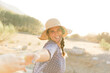 © Luna Vandoorne/Westend61 - Cheerful young woman wearing sun hat during sunny day