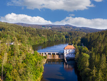 Drone View Of Hydroelectric Power Station On Hollensteinsee Lake And Surrounding Forest In Summer