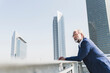 © UWE_UMSTAETTER/Westend61 - Serious mature businessman in the city looking around
