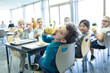 © Pavel Horak/Westend61 - Pupils having lunch in school canteen