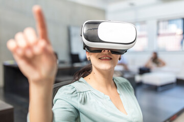 Woman wearing VR glasses in office