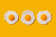© gemma ferrando & jeremie roman/Westend61 - Studio shot of three fried eggs