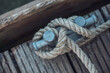 © Michael Malorny/Westend61 - Close-up of rope tied to cleat on houseboat