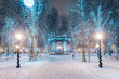© ibreakphotos/Westend61 - Snow covered footpath amidst illuminated trees during Advent at night