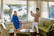 © ALTO IMAGES/Stocksy - Man taking photo of a woman on holiday