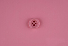 Minimal Pink Background With Pink Button In Middle. Flat Lay