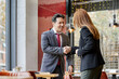 © ALTO IMAGES/Stocksy - Businessman shaking hands with a female colleague