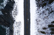 © Shayd Johnson/Stocksy - car overhead shot along a snowy road