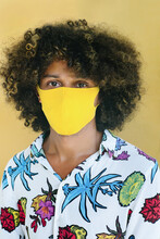 Curly Man In A Protective Mask From Textiles.