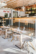 © Manu Prats/Stocksy - Interior of restaurant with modern wooden furniture