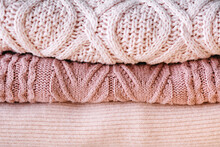 A Stack Of Knitted Sweaters.
