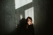 © irina polonina/Stocksy - Asian girl in a dark room.