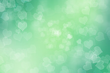 Bokeh Green Background With Heart Theme. 