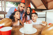 Latin family celebrating birthday party at home