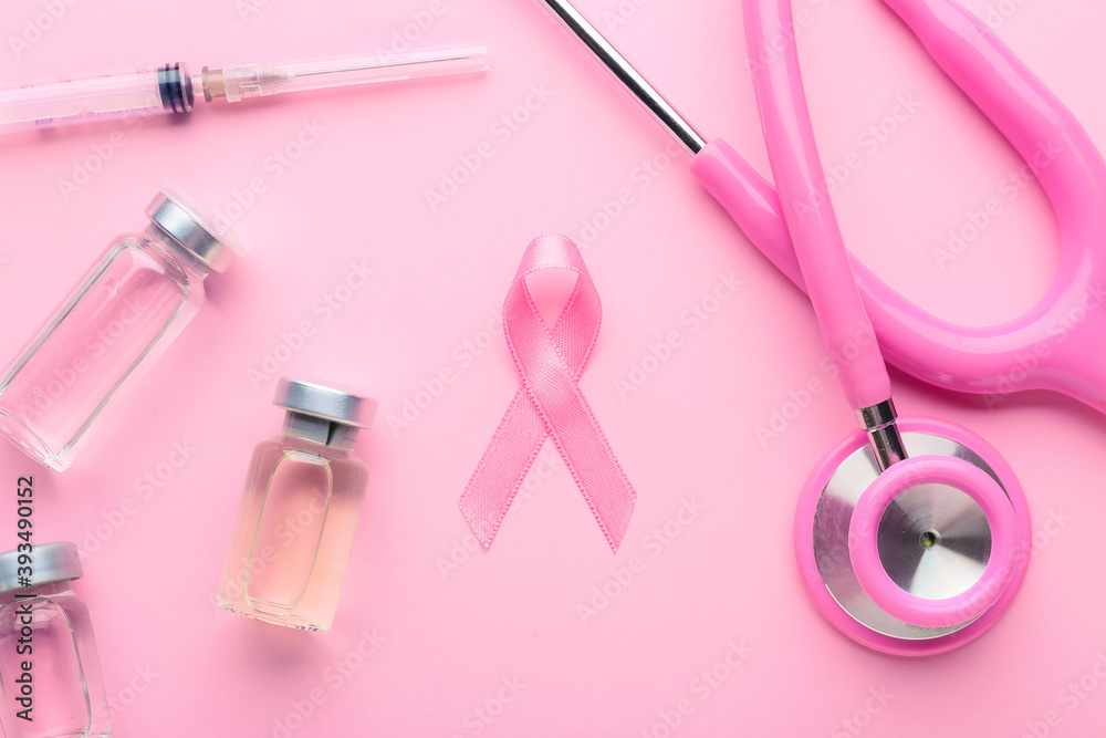Pink ribbon, remedy and stethoscope on color background. Breast cancer awareness concept