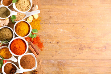 Wall Mural - various spices frame on wood background