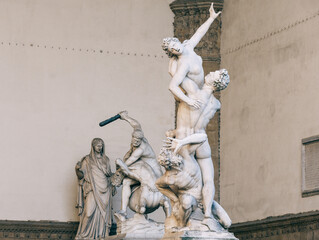 Wall Mural -  The Rape of Sabine Women Renaissance sculpture 1574 1580 by Giambologna 1529 608 , in the Loggia dei Lanzi building, located in Piazza della Signoria square in Florence, Italy