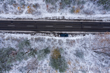 Wall Mural - road through winter forest, top view