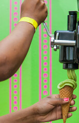 Poster - African woman making green ice cream with an ice cream machine