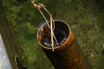 Closeup of water in a rusty dirty pipe